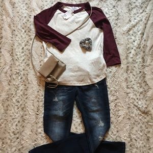 Maroon sleeved cream colored top.